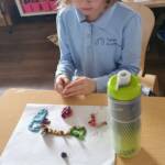 Shira with clay